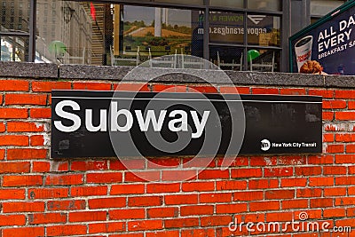 New York City subway sign entrance on brick wall Editorial Stock Photo