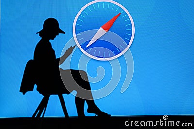 NEW YORK, USA, 25. MAY 2020: Safari graphical web browser developed by Apple Young woman silhouette sitting on chair and playing Editorial Stock Photo