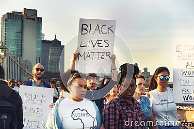 New York, USA, October 01, 2018. Procession in support of people of different colors on the Brooklyn Bridge Editorial Stock Photo
