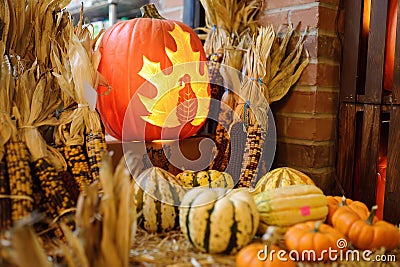 New York, USA - October 20, 2018: Traditional marketplace CHELSEA MARKET in New York. Scared Halloween carved pumpkin among Editorial Stock Photo