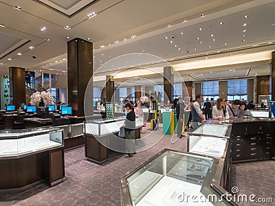Shoppers choose jewelry at Tiffany store in Manhattan Editorial Stock Photo
