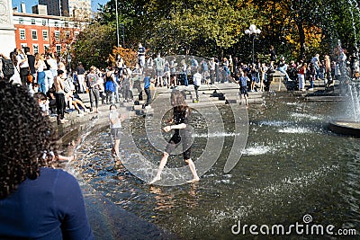 New Yorkers play in fountain in Washington Square Editorial Stock Photo