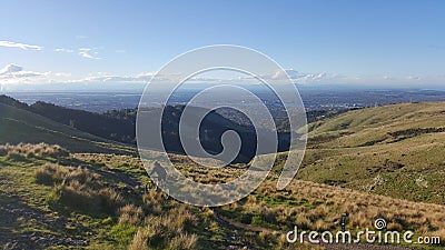 Man mountain biking across Victoria hills of Christchurch Editorial Stock Photo