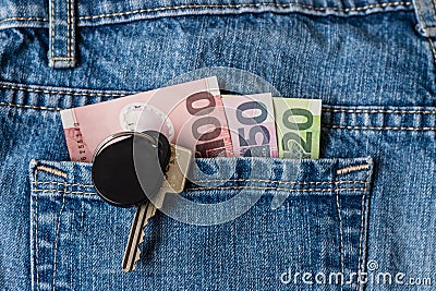 New Zealand dollars and keys in jeans pocket Stock Photo