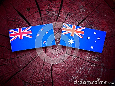 New Zealand flag with Australian flag on a tree stump Stock Photo