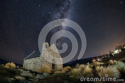 Famous tourist attraction of Church at Lake Tekapo with milky way galaxy, New Zealand at night Stock Photo