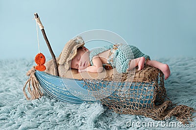 Newborn Baby Boy in Fisherman Outfit Stock Photo