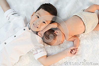 Newborn baby boy and older brother Stock Photo