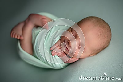 Newborn baby boy sleeping confort pose on a beanbag Stock Photo