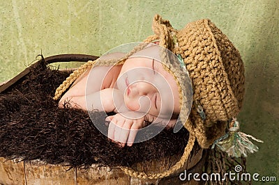 Newborn Baby Boy Wearing a Fishing Hat Stock Photo