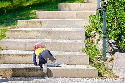 Newborn baby climb stairs step by step Stock Photo