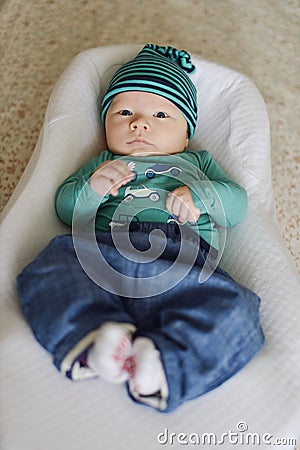 Newborn baby in the cocoon Stock Photo