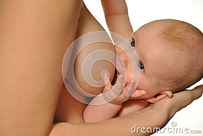 Newborn baby eating breast milk Stock Photo