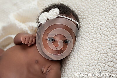 Newborn Baby Girl on Faux Sheepskin Blanket Stock Photo