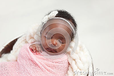 Newborn Baby Girl Sleeping in Bowl Stock Photo