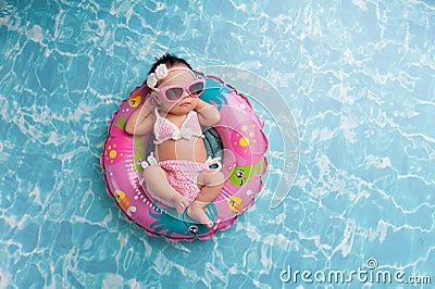 Newborn Baby Girl Wearing a Bikini and Sunglasses Stock Photo