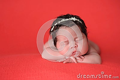 Newborn Baby Girl Wearing a Rhinestone Headband Stock Photo