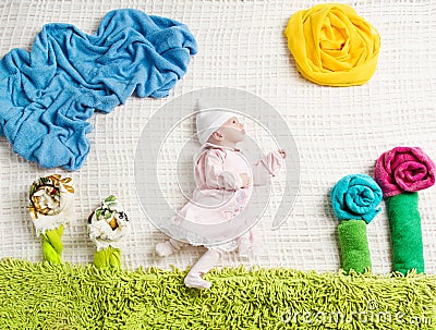 Newborn baby lying on creative clothing Stock Photo