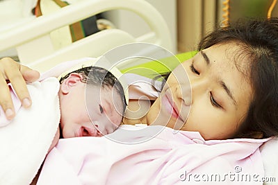 Newborn baby and mom Stock Photo