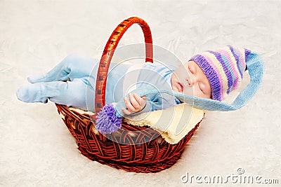 A newborn baby in purple knitted cap Stock Photo