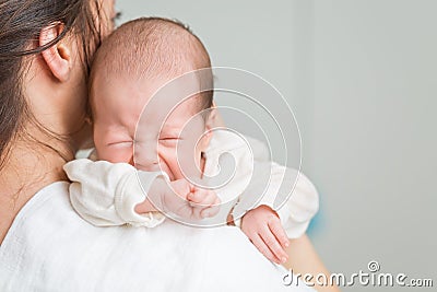 Newborn baby screaming in pain with colic Stock Photo