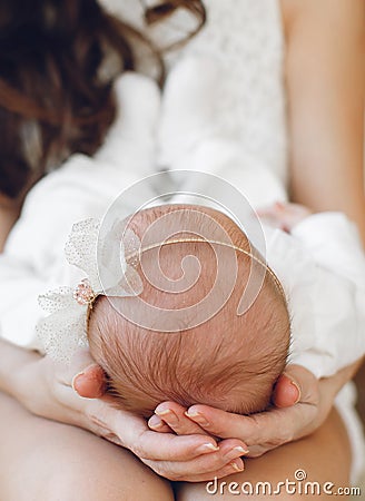 Newborn baby sleeping on mother's hands. Stock Photo