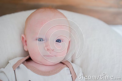 Newborn baby with a slight smile Stock Photo
