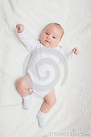 Newborn baby in white romper Stock Photo