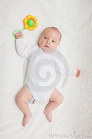 Newborn baby in white romper Stock Photo