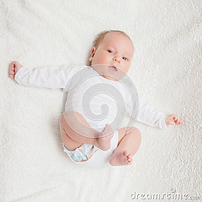 Newborn baby in white romper Stock Photo