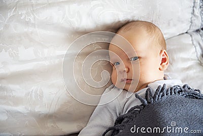 Newborn in bed Stock Photo