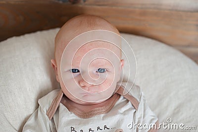 A newborn child with a sullen expression Stock Photo