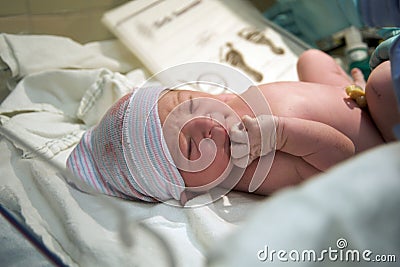 Newborn in the delivery room Stock Photo
