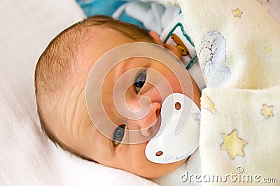 Newborn with dummy - pacifier Stock Photo