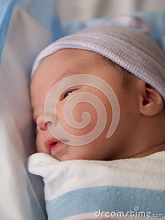 Newborn with eyes open Stock Photo