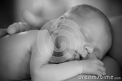 Newborn Infant sleeping black and white Stock Photo