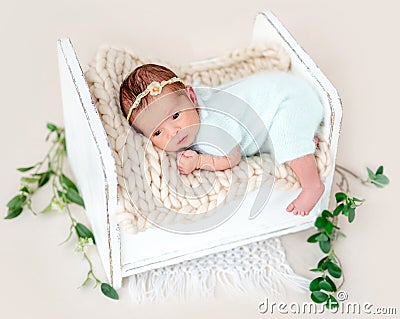 Newborn lying awake Stock Photo