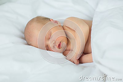The newborn sleeps. Age 10 days. Stock Photo