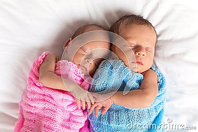 Newborn twins sleeping together Stock Photo