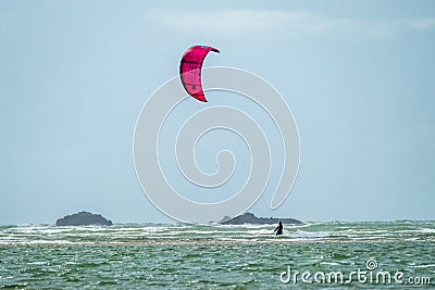 Newborough , Wales - April 26 2018 : Kite flyer surfing at Newborough beach - Wales - UK Editorial Stock Photo