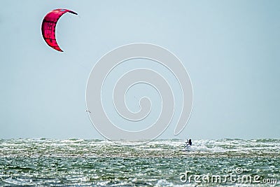 Newborough , Wales - April 26 2018 : Kite flyer surfing at Newborough beach - Wales - UK Editorial Stock Photo