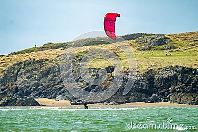 Newborough , Wales - April 26 2018 : Kite flyer surfing at Newborough beach - Wales - UK Editorial Stock Photo