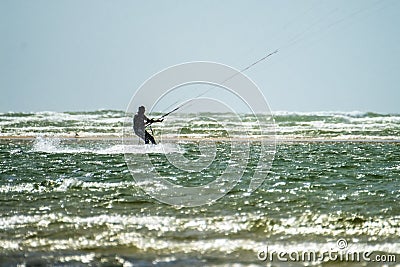 Newborough , Wales - April 26 2018 : Kite flyer surfing at Newborough beach - Wales - UK Editorial Stock Photo