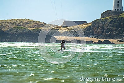 Newborough , Wales - April 26 2018 : Kite flyer surfing at Newborough beach - Wales - UK Editorial Stock Photo