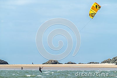 Newborough , Wales - April 26 2018 : Kite flyer surfing at Newborough beach - Wales - UK Editorial Stock Photo