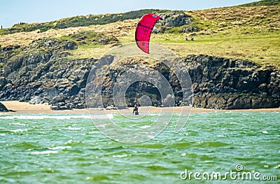 Newborough , Wales - April 26 2018 : Kite flyer surfing at Newborough beach - Wales - UK Editorial Stock Photo