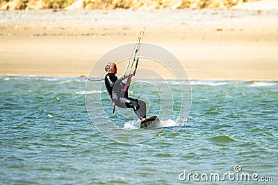 Newborough , Wales - April 26 2018 : Kite flyer surfing at Newborough beach - Wales - UK Editorial Stock Photo