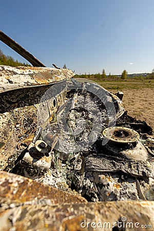Newburn UK: April 2022: A stolen car which has been burnt out and dumped in a field Editorial Stock Photo