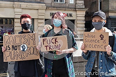 Anti-racism and black lives matters protesters holding homemade placards at rally demonstration Editorial Stock Photo