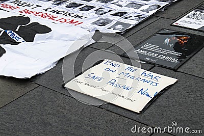 Anti-racism immigration and black lives matters posters on floor at demonstration Editorial Stock Photo